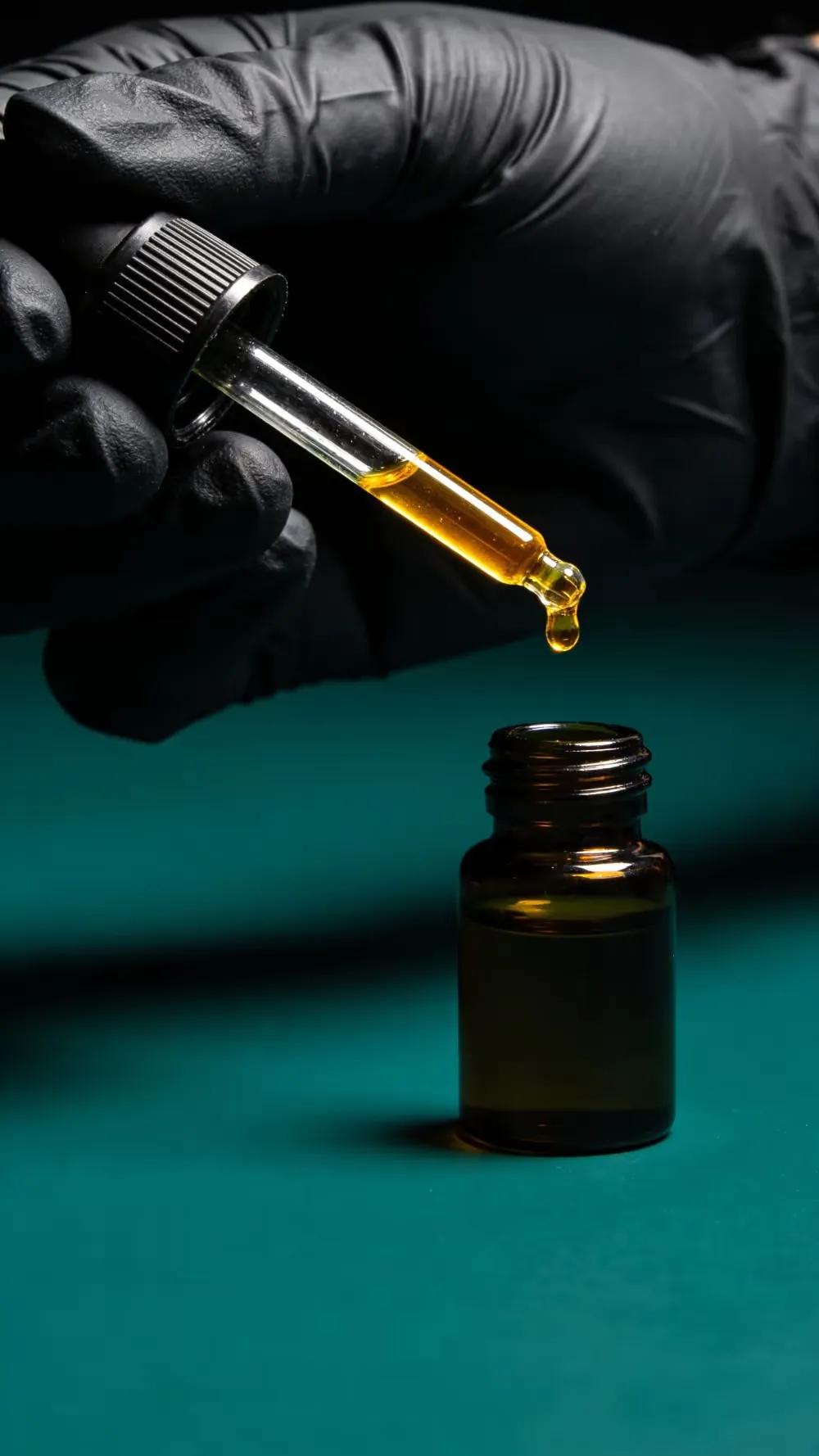 Pure, undiluted fragrance oil being poured